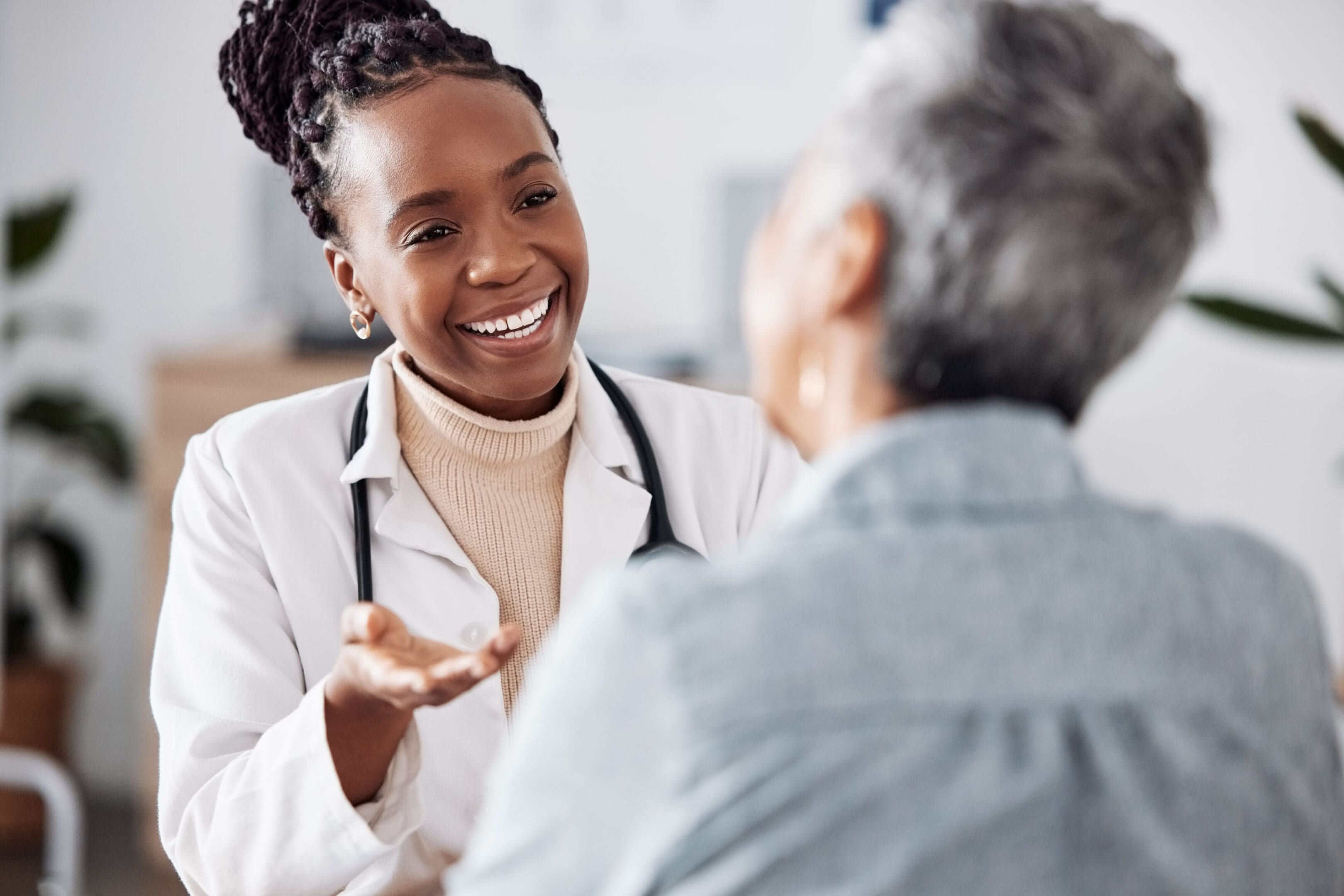 A doctor is talking to an older person.